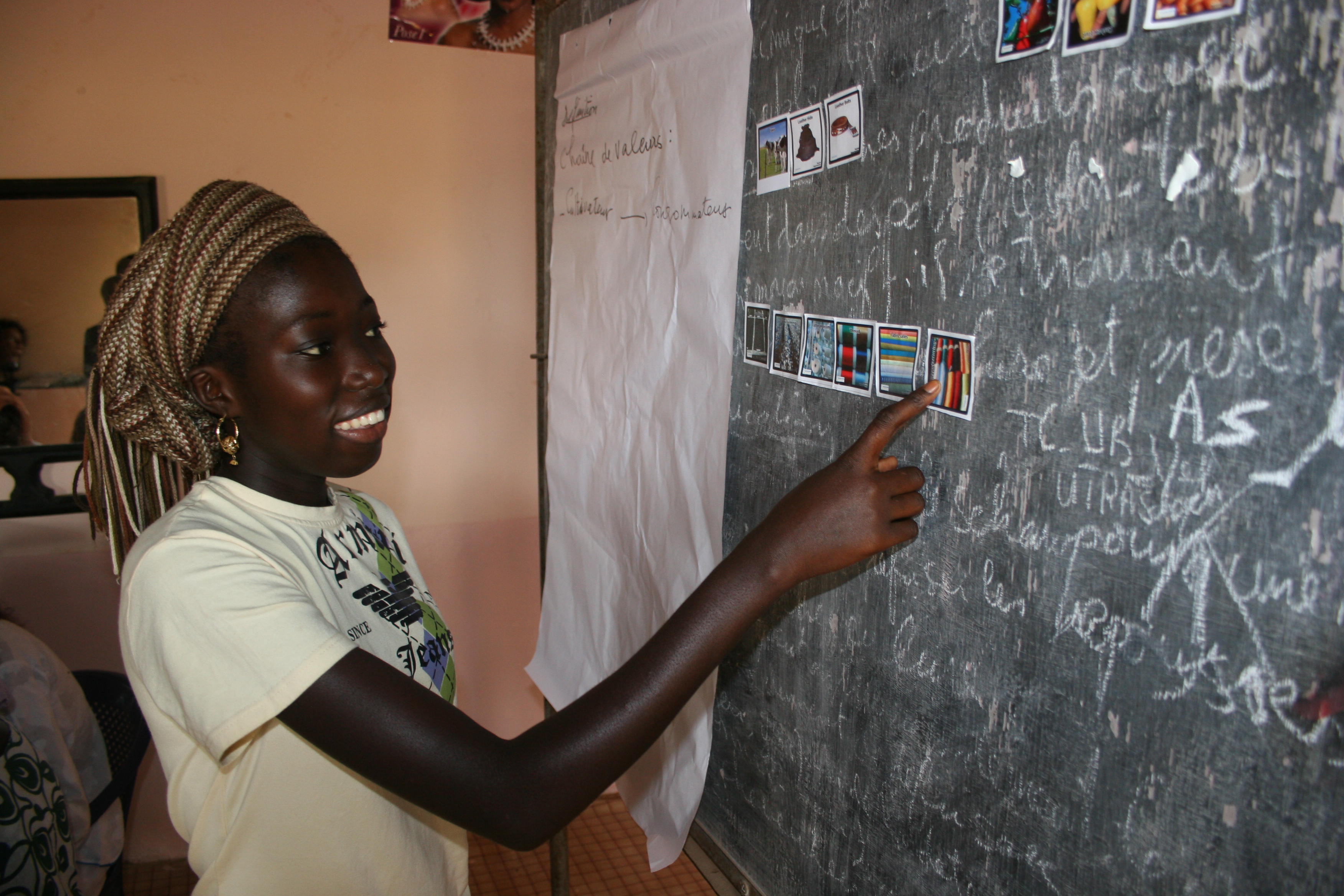 Photo of adolescent girl working on blackboard at school Photo of adolescent girl working on blackboard at school