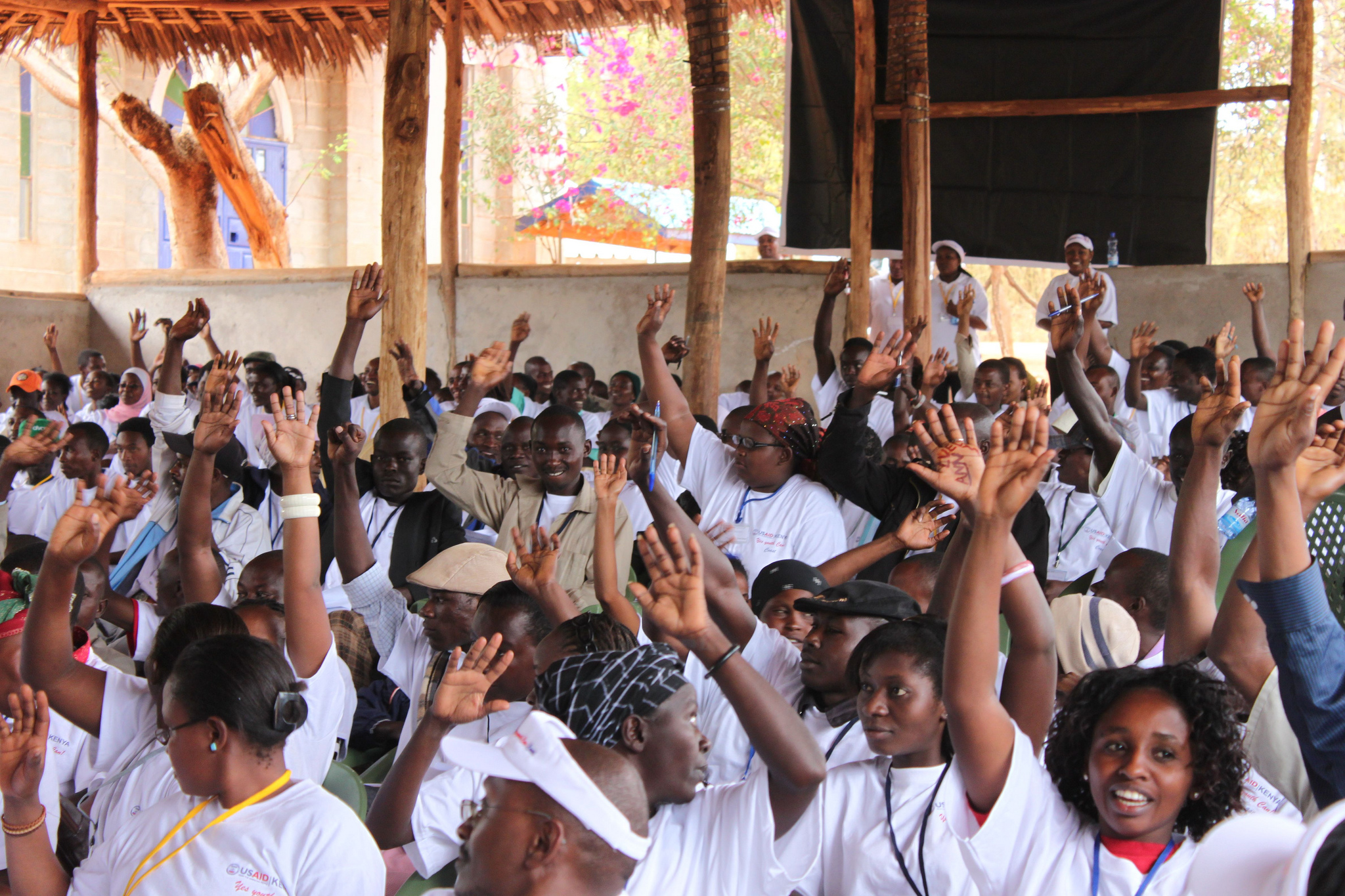 Young people are raising hands. A Model Democracy For Kenyan Youth, Photo by Donatella Lorch, USAID Young people are raising hands. A Model Democracy For Kenyan Youth, Photo by Donatella Lorch, USAID