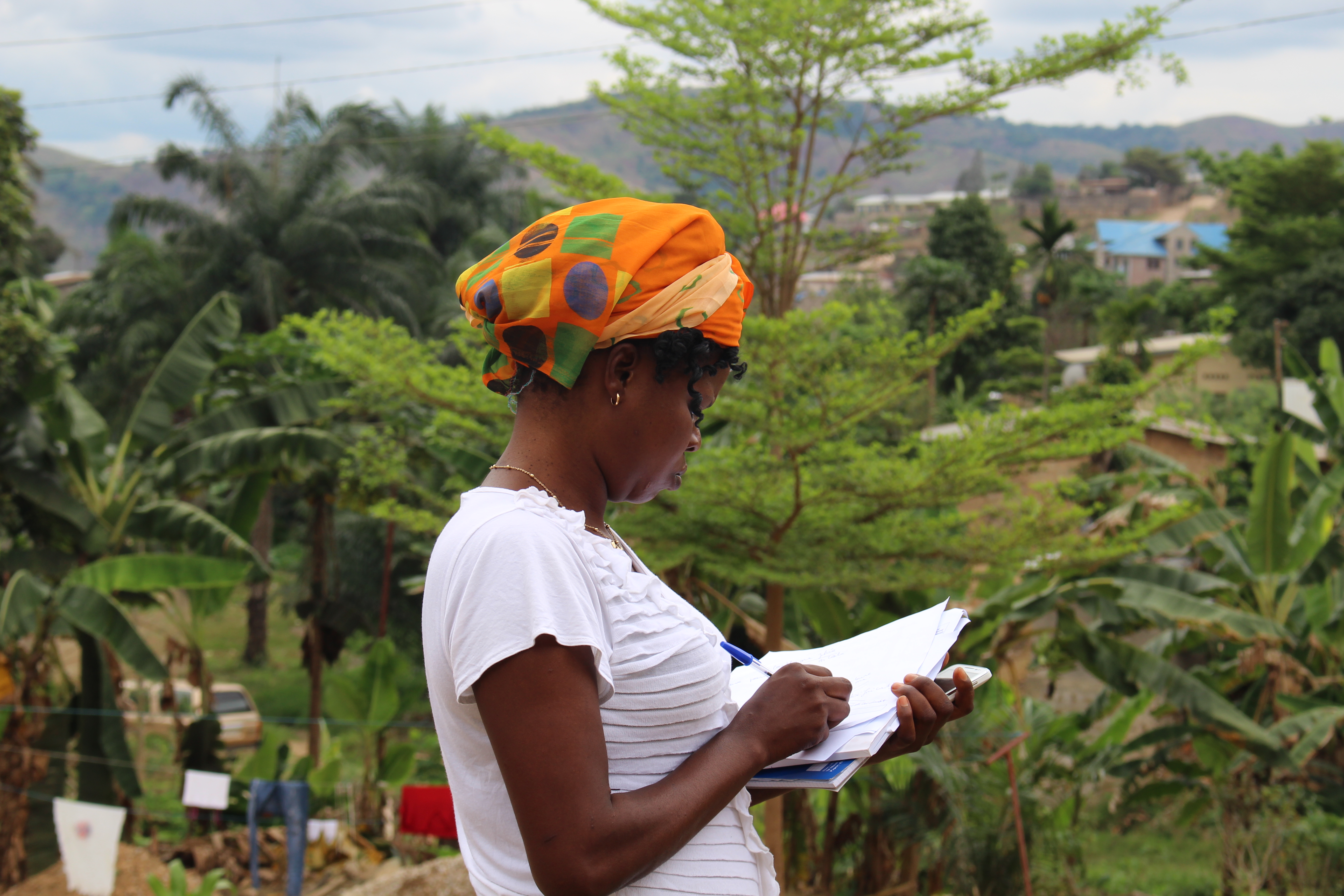 A resident enumerator in Congo (Kinshasa), prepares for another round of data collection for PMA2020, a mobile technology-based survey project that supports routine, rapid-turnaround, high quality data on family planning and other health indicators. © 2015 PMA2020/Shani Turke, Courtesy of Photoshare A resident enumerator in Congo (Kinshasa), prepares for another round of data collection for PMA2020, a mobile technology-based survey project that supports routine, rapid-turnaround, high quality data on family planning and other health indicators. © 2015 PMA2020/Shani Turke, Courtesy of Photoshare