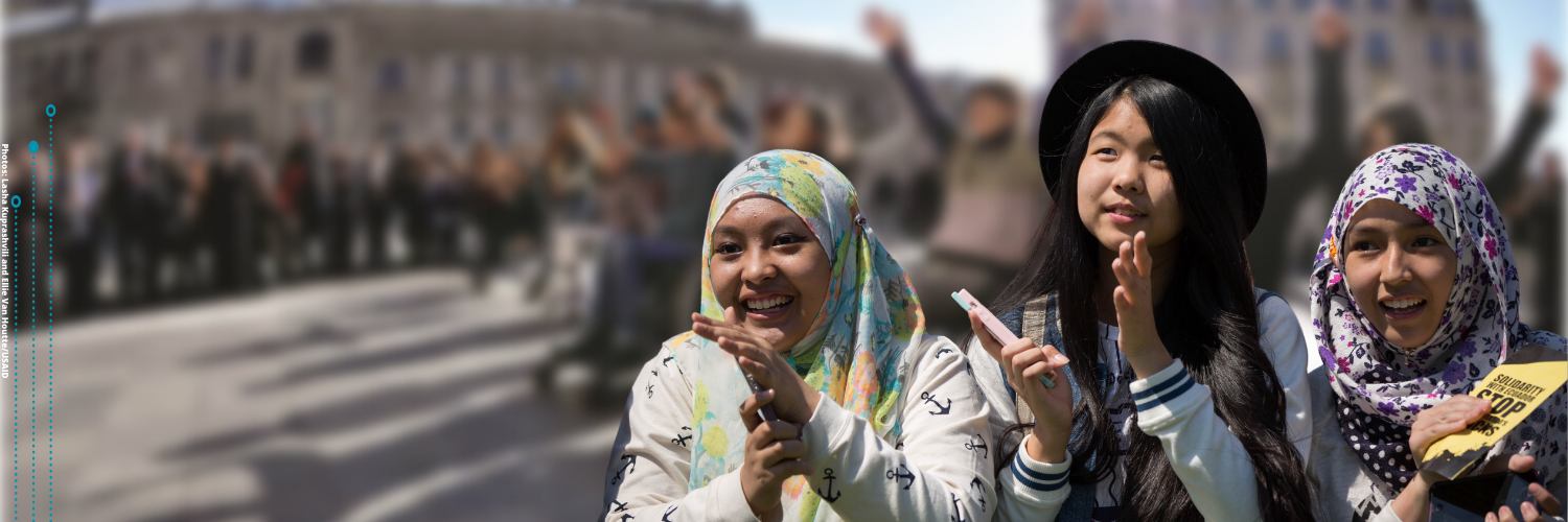 Three young women with head scarf clapping (Photos: Lasha Kuprashvili and Ellie Van Houtte/USAID) Three young women with head scarf clapping (Photos: Lasha Kuprashvili and Ellie Van Houtte/USAID)